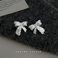 Silver Tone Crystal Pave Bow Stud Earrings Engraved Texture view 1