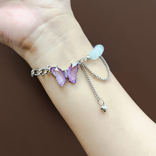 Wrist wear of purple butterfly bracelet with bead cluster