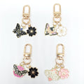 Gold Tone Butterfly Skull and Cherry Blossom Clip Keychains view 3