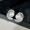 Silver Tone Faux Pearl Stud Earrings with Leaf CZ Accents view 5