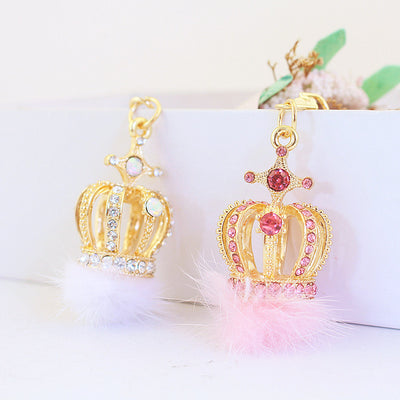 Pink and white crown pom pom keychains displayed side by side.