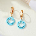 Gold Tone Open Smiley Face Huggie Drop Earrings in Six Colors view 7