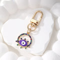Gold Tone Rhinestone Round Evil Eye Clip Keychains in Six Colors view 9