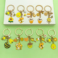 Bee and Honeycomb Charm Keychains Featuring Yellow Flower Across 33 Pictured Variations view 4