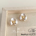 White Pearlized Three-Petal Orchid Flower Stud Earrings view 3