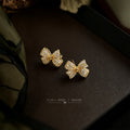 Gold Tone Clear Stone Pave Sculpted Ribbon Bow Stud Earrings view 4