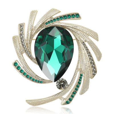 Green teardrop crystal swirl brooch front