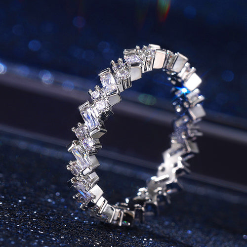 Round view of the mixed-cut clear-stone eternity ring
