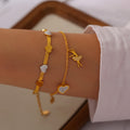 Gold Heart Snake Chain And Ballerina Charm Bracelets view 3
