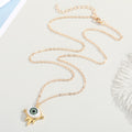 Gold Tone Green Eyeball Pendant Necklace with Spiked Lower Frame view 4
