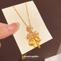 Gold Tone Bow And Flower Pendant Necklace With Teardrop Charms view 1