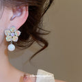 Iridescent Crystal Flower Stud Earrings with Round White Pearl Drops view 4