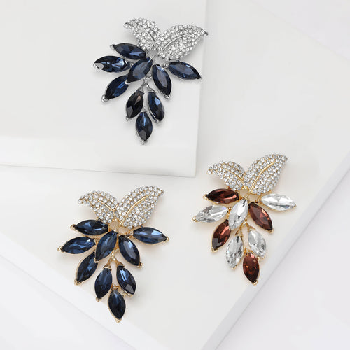 Three leaf crystal brooches gold navy champagne silver navy on white