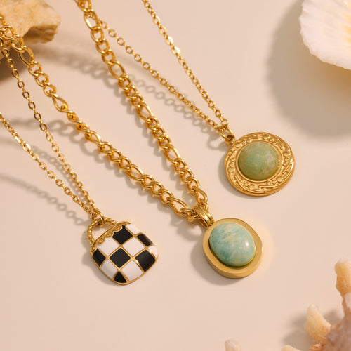 Neckline view of enamel and natural stone necklaces in main image 1.