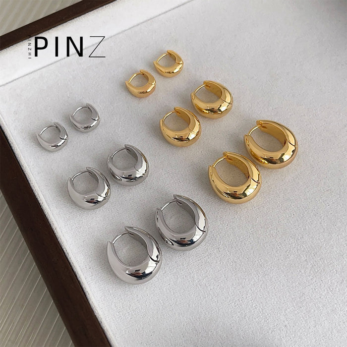 Polished Oval Huggie Hoop Earrings In Gold Silver And Three Sizes