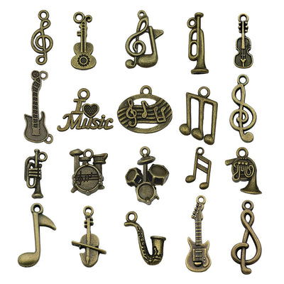 Gold-tone musical instrument charms arranged on a light background