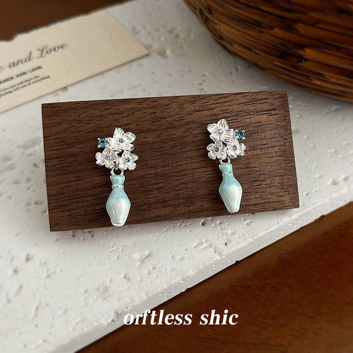 Silver Tone Floral Stud Earrings With Detachable Leaf And Blue Vase Drops