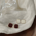 Gold Tone Rounded Square Stud Earrings In White And Burgundy view 4