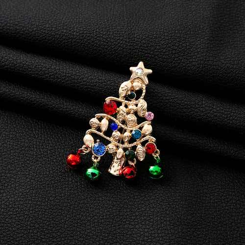 Gold Christmas tree brooch with red green bells on black textured leather