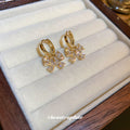 Gold Crystal Bow Huggie Hoop Earrings Polished Metal Jewelry view 4