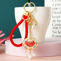 Jeweled Ruyi Lock, Apple and Braided Wrist Loop Keychain Options view 1