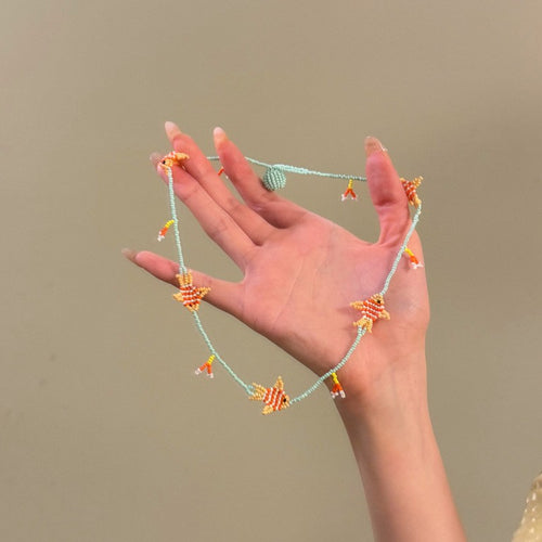 displayed product view of colorful fish charm necklace