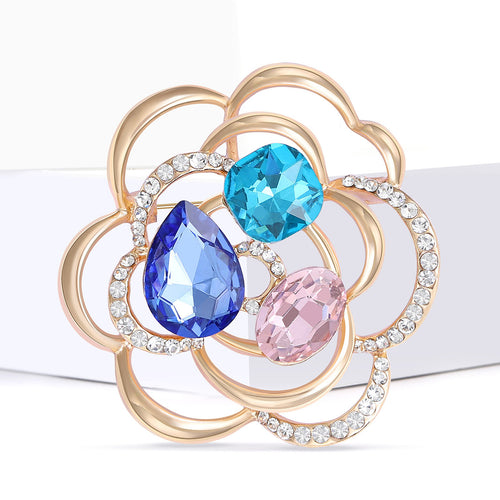 Multicolor crystal openwork flower brooch on white blocks