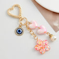 Pink Heart Clasp Keychain with Iridescent Hearts and Glitter Flower Charm view 2