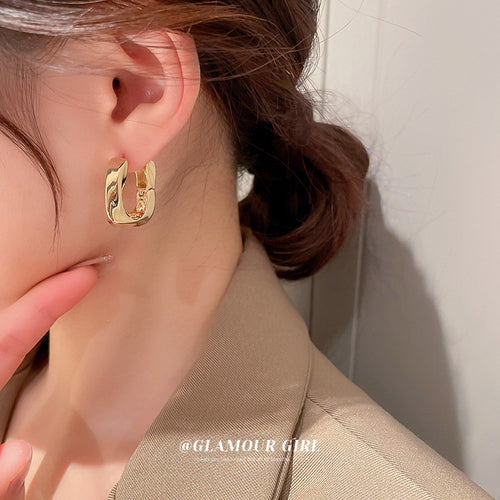 Detail view 2 of sculpted square hoop earrings in gold and silver tone
