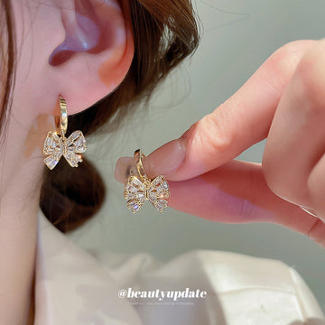 Gold Crystal Bow Huggie Hoop Earrings Polished Metal Jewelry