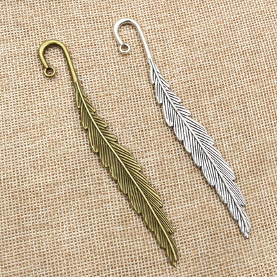 Long Curved Feather Pendants arranged in the pictured color and finish options