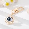 Gold Tone Sculpted Sun and Lash Realistic Eye Clip Keychains view 12