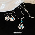 Silver Teardrop Flower Earrings and Pendant Necklace view 4