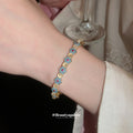Gold Pink Halo Link Bracelet and Blue Flower Open Cuff view 3