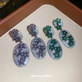 Pair of Metal Tone Purple and Green Crystal Oval Drop Earrings view 2