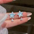 Blue Star Crystal Drop Stud Earrings with Reflective Details view 1