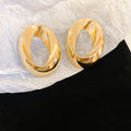 Sculptural Open Oval Stud Earrings in Gold and Silver Tones view 6