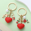 Red Heart Charm Keychains In 4 Rose, Butterfly, Tag And Pearl Styles view 4