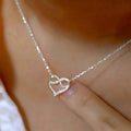 Interlocking Double Heart Pendant Necklace In Gold And Silver Tones view 2