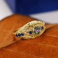 Opalescent Oval Blue Stone Filigree Ring In Two Metal Tones view 4