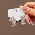 Silver Butterfly and Black Heart Mismatched Stud Earrings view 1