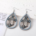 Silver Tone Gothic Cross and Praying Hands Acrylic Hook Earrings view 3