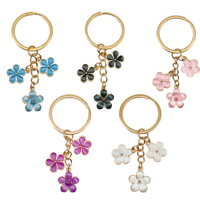 Main display of white purple and pink blossom pearl-look keychains