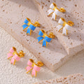 Enamel Bow Stud Earrings Pink White Blue Gold and Steel Frames view 4