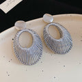 Woven Open Oval Drop Stud Earrings in Gold and Silver view 7