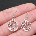 Snowflake and Star Round Drop Earrings in Silver Tone view 3