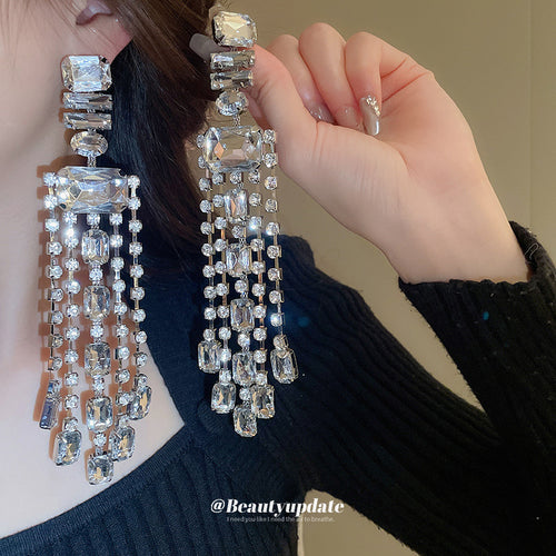 silver tone rectangular crystal waterfall earrings displayed from a second angle