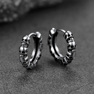 Product view showing sculpted skull hinged hoop earrings