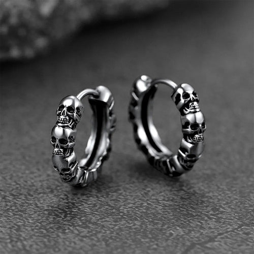 Product view showing sculpted skull hinged hoop earrings