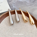 Sculptural Long Teardrop Stud Earrings in Silver and Gold Tones view 2